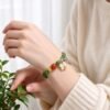 Shennong’s Crimson Herbfruit Green Jade Bracelet with Red Agate (10mm)