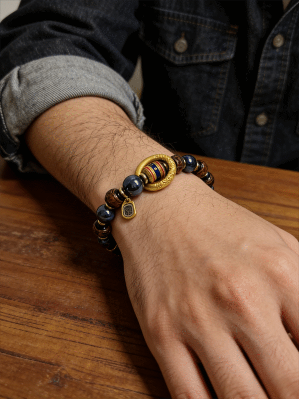 Men wearing the After the Flood Gonggong inspired agate bracelet with 10mm beads, styled with a watch for a modern masculine look