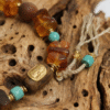Amber Dawn & Agarwood Earthheart Bracelet – Pangu Edition Detail Detail of Amber Dawn and Agarwood Earthheart Bracelet Pangu Edition with amber stones natural wood beads and hand tied cord