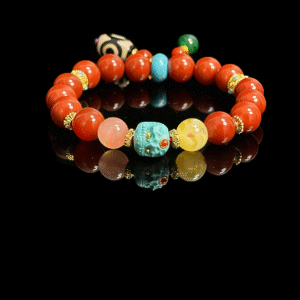 Crimson Fury & Turquoise Totem Bracelet – Xingtian Myth Collection (10mm), featuring vibrant crimson agate beads, a carved turquoise totem centerpiece, natural gemstone accents, and gold spacers, inspired by the fearless warrior Xingtian and symbolizing courage, resilience, and unbreakable will
