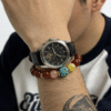 Man wearing the Xingtian Myth Crimson Fury & Turquoise Totem Bracelet alongside a wristwatch, emphasizing the bracelet’s bold masculine design, polished agate beads, and myth-inspired symbolism.