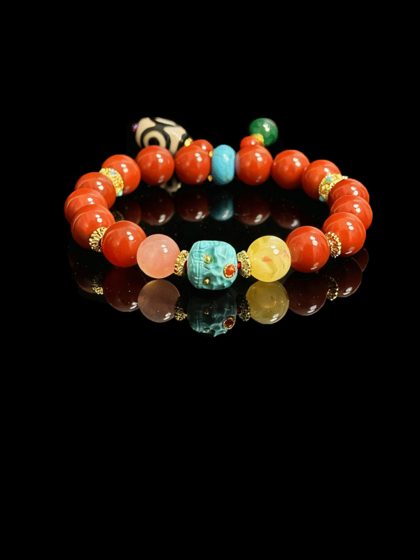 Crimson Fury & Turquoise Totem Bracelet – Xingtian Myth Collection (10mm), featuring vibrant crimson agate beads, a carved turquoise totem centerpiece, natural gemstone accents, and gold spacers, inspired by the fearless warrior Xingtian and symbolizing courage, resilience, and unbreakable will