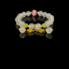 Goddess Moonstone and sunrise agate bracelet inspired by Chang’e, featuring smooth 10mm natural moonstone beads with sunrise agate accents and gold tone spacers on a black background