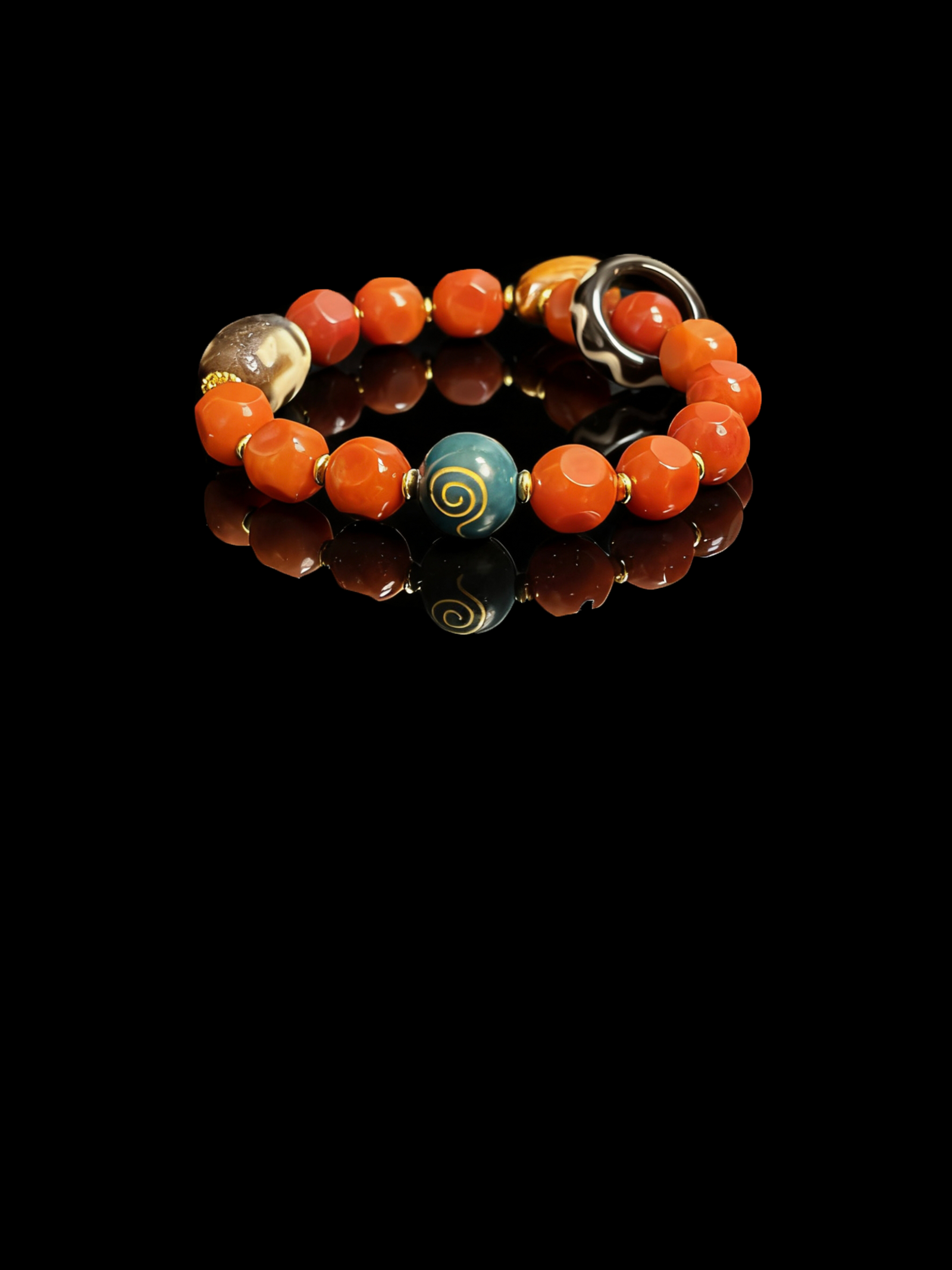 Xingtian inspired Bound Resolve red agate bracelet (10mm) with faceted red beads, gold spacers and a blue swirl centerpiece photographed on a black reflective background