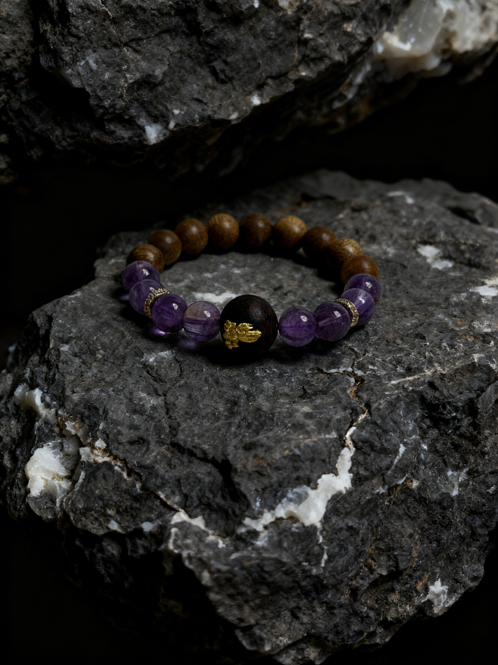 Product photo of the Mother of Earth bracelet with purple beads and natural wood centerpiece