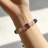 Settled Order Bracelet – Nüwa Inspired Elegant Mythic Bracelet Styling (11mm) Lifestyle wrist shot of the Settled Order Bracelet inspired by Nüwa, showcasing purple amethyst, white agate, and crystal beads with a refined, balanced aesthetic