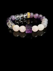Settled Order Bracelet inspired by Nüwa, featuring amethyst, rose quartz, and clear crystal beads with gold accents, symbolizing balance and harmony