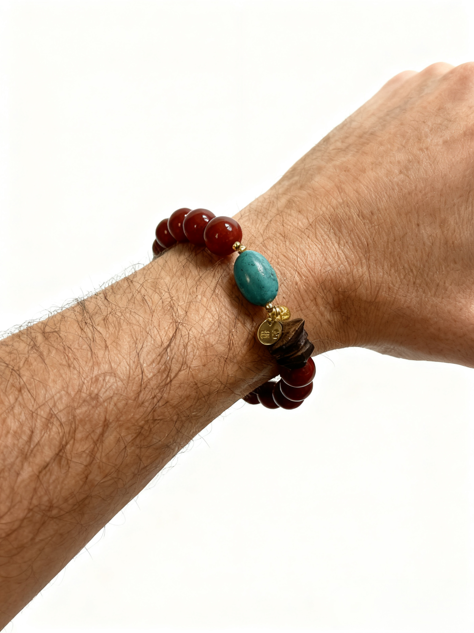 Man wearing the Steadfast Heart Red Agate Bracelet inspired by Xingtian, featuring bold 10mm red agate beads and a powerful, grounded design symbolizing resilience and courage