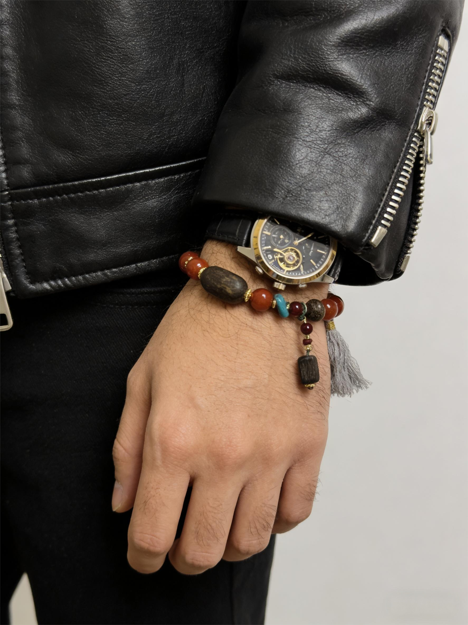 Agarwood War-Totem Agate Bracelet Xingtian Edition 10mm worn on men’s wrist with leather jacket and watch