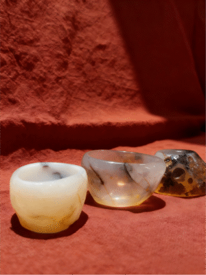 hand-carved mineral collectibles titled Agate Stillness Cups, featuring a set of small agate stone cups with natural translucency and soft tonal variations