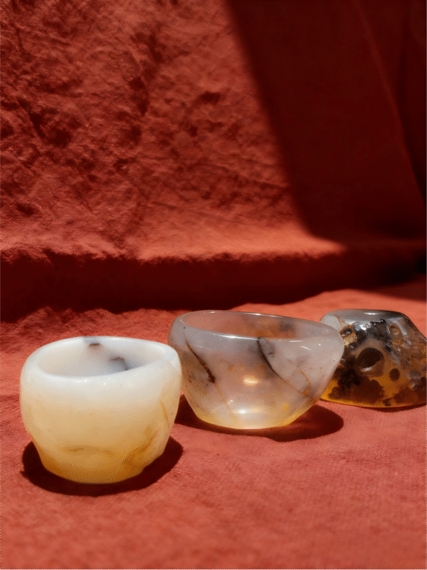 Agate Stillness Cups – Hand-carved Mineral Collectibles hand-carved mineral collectibles titled Agate Stillness Cups, featuring a set of small agate stone cups with natural translucency and soft tonal variations