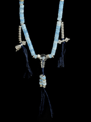 jingwei inspired bracelet featuring aquamarine and clear quartz beads, designed as a goddess-themed wearable piece with blue stone accents and tassel details