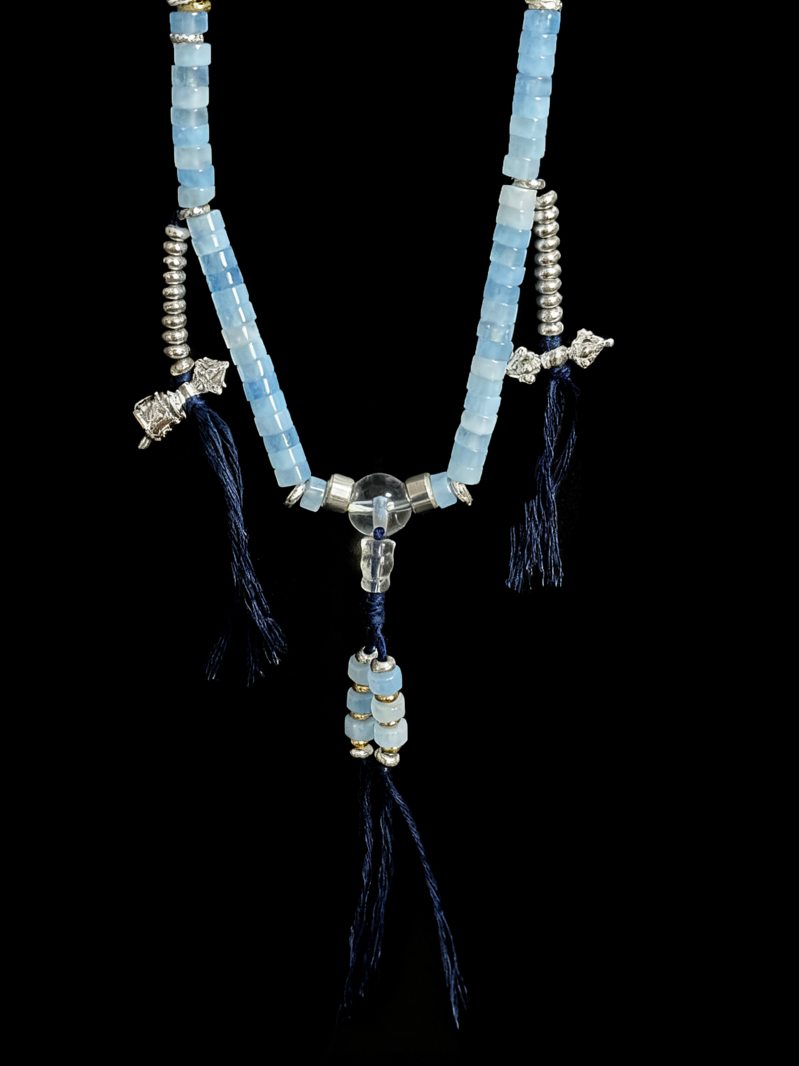 jingwei inspired bracelet featuring aquamarine and clear quartz beads, designed as a goddess-themed wearable piece with blue stone accents and tassel details