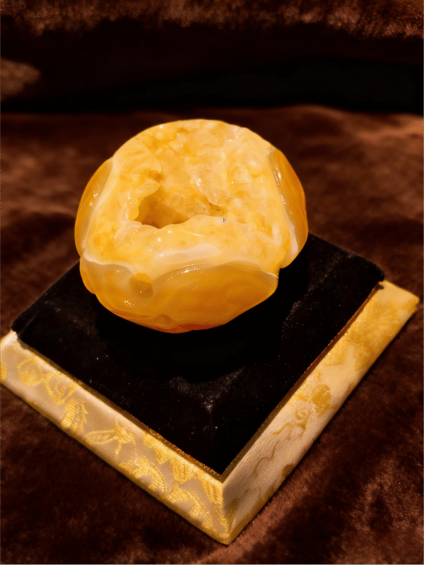 Golden Core Agate – Handheld Agate Artwork handheld agate artwork titled Golden Core Agate, featuring a polished agate form with a luminous golden core and natural crystalline interior