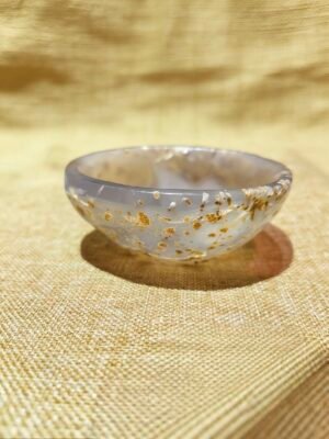 hand-carved collectible titled Inner Gold Vessel, featuring a translucent agate bowl with natural golden mineral inclusions
