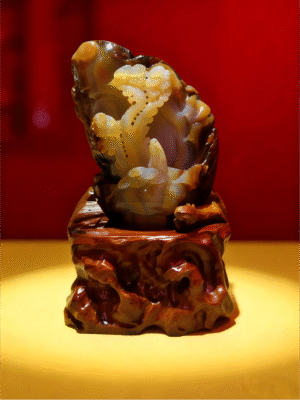 hand-carved stone collectible titled Pine on the Cliff, depicting pine-inspired forms emerging from a steep cliff-like stone composition on a carved base