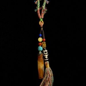 Primordial Layered Agate and Dzi pendant necklace inspired by Pangu mythology, featuring a natural layered agate pendant, traditional Dzi bead, turquoise accent beads, and multicolored hand-wrapped tassel on a black cord