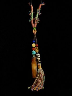 Primordial Layered Agate and Dzi pendant necklace inspired by Pangu mythology, featuring a natural layered agate pendant, traditional Dzi bead, turquoise accent beads, and multicolored hand-wrapped tassel on a black cord