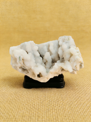 natural mineral collectible titled White Cloud Crystal, featuring a white cloud-like crystal formation displayed on a stand