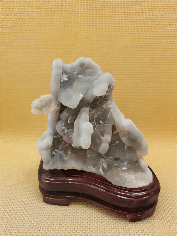 Cloudstone Peak – Natural Mineral Collectible natural mineral collectible titled Cloudstone Peak, featuring layered cloud-like stone formations rising in a mountain-like structure