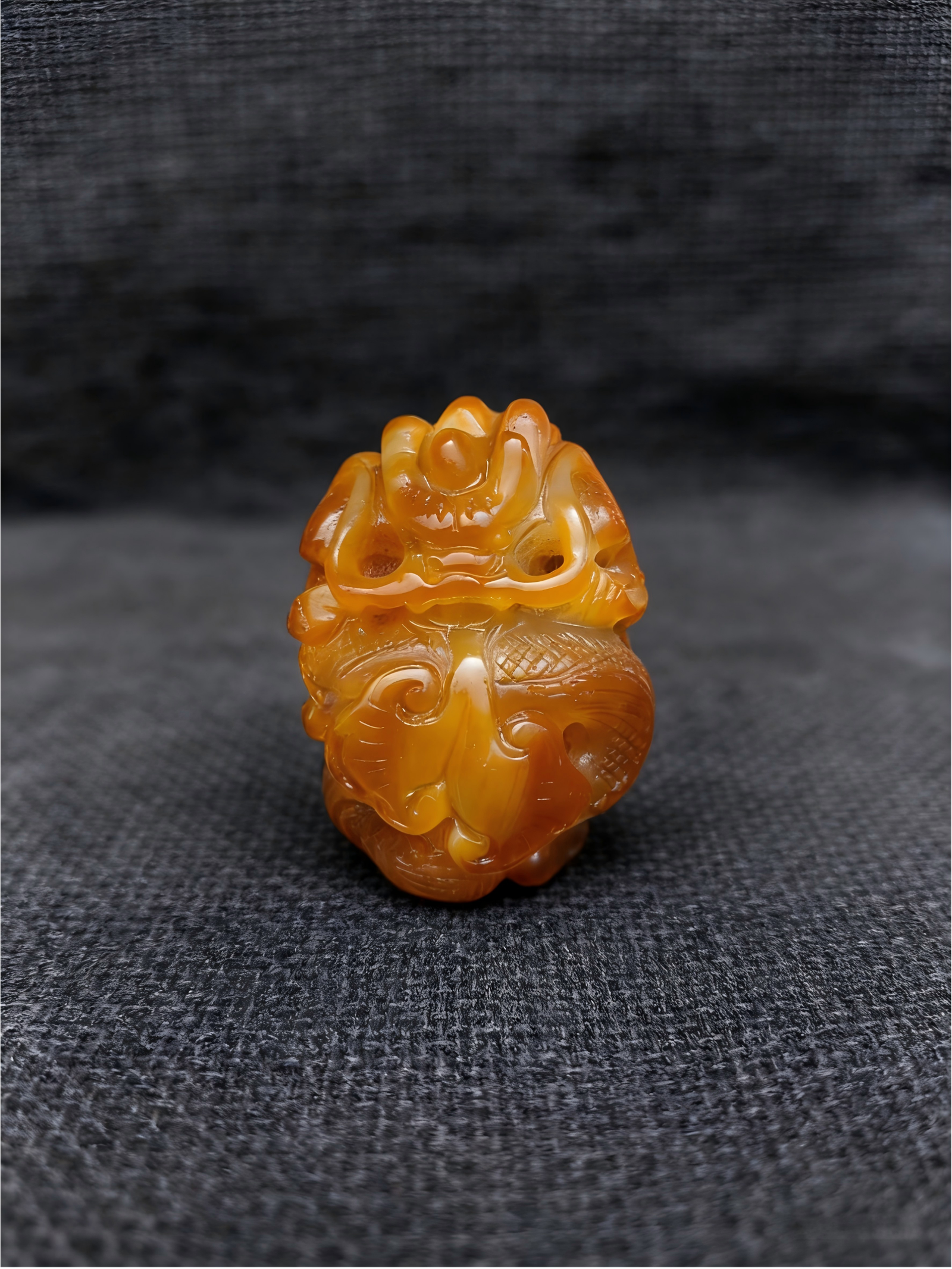 handheld agate artwork titled Golden Guardian, carved from natural golden agate stone as a guardian-style collectible sculpture