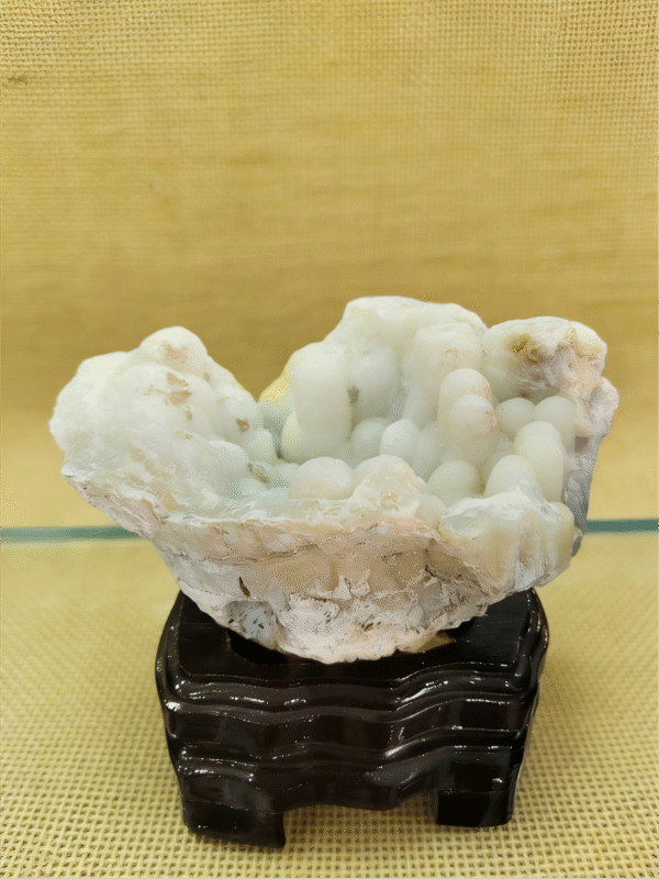 natural mineral collectible titled White Cloud Basin, featuring soft white stone formations shaped like a cloud-filled basin