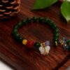 Shennong’s Crimson Herbfruit Green Jade Bracelet with Red Agate (10mm) Shennong’s Crimson Herbfruit Green Jade Bracelet with Red Agate (10mm)