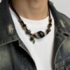 Gonggong’s Turbulent Black Dzi & Agarwood Pendant Necklace