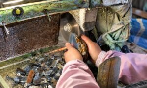Yun Agate's worker is cutting a rough natural agate