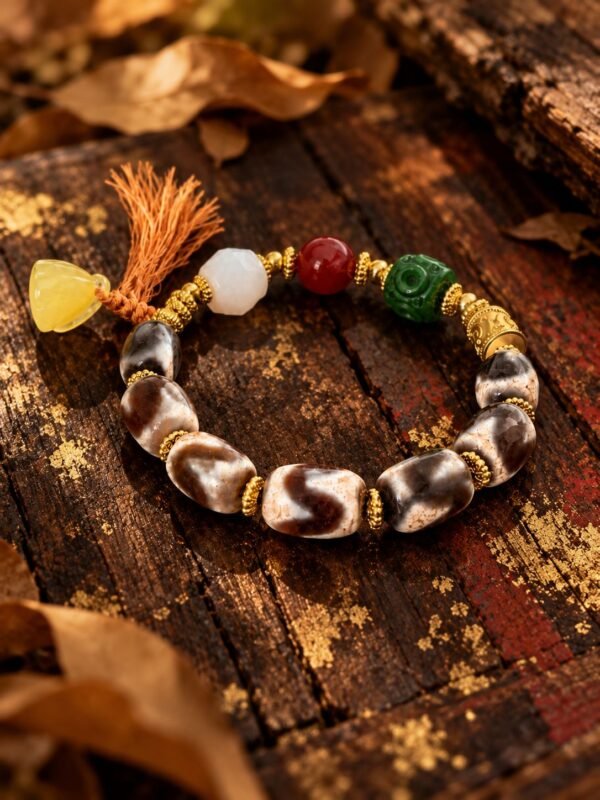 Gonggong’s Turbulent Elements Dzi Bead Bracelet with Agate, Jade & Beeswax Amber(12mm) Gonggong-inspired beaded bracelet featuring Dzi beads, agate, jade, beeswax amber, and multicolored woven cord.